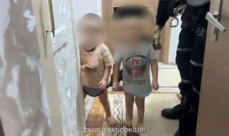 Bağlı qapı arxasında qalan azyaşlılar belə xilas edildi -  VİDEO